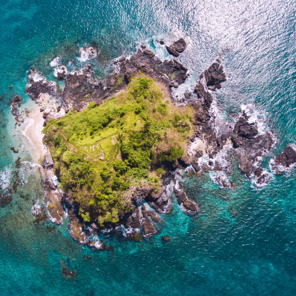 Lush green island with a mountain peak in the center