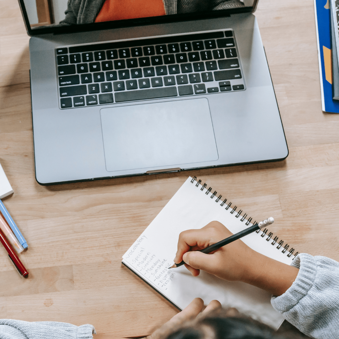 Focused professional working on a laptop in an office